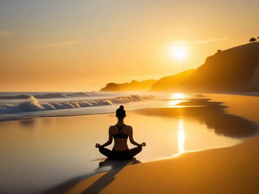 Retiros de yoga y meditación al amanecer en una playa tranquila con una figura en silueta meditando bajo la suave luz dorada